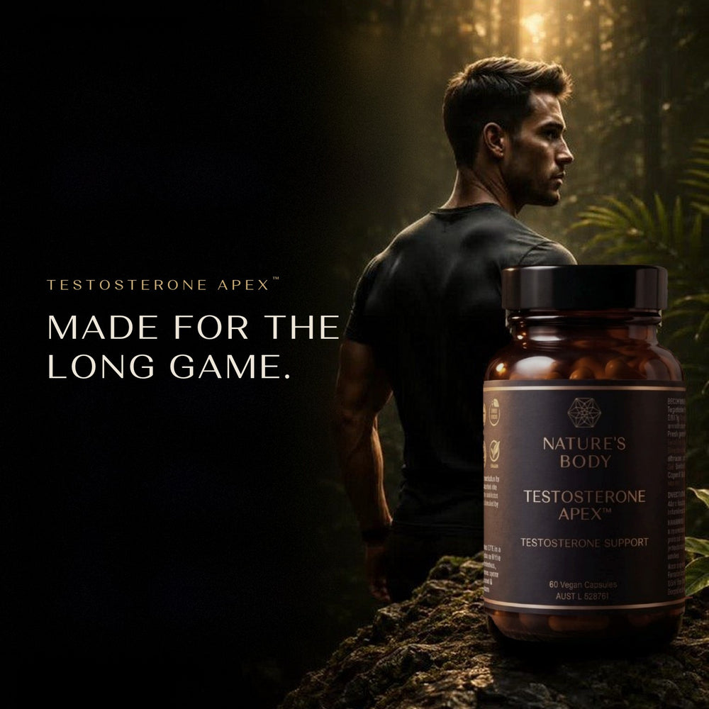 Man in a black t-shirt in a sunlit forest beside a bottle of Nature’s Body Testosterone Apex on a rock, with the words “Made for the long game.”